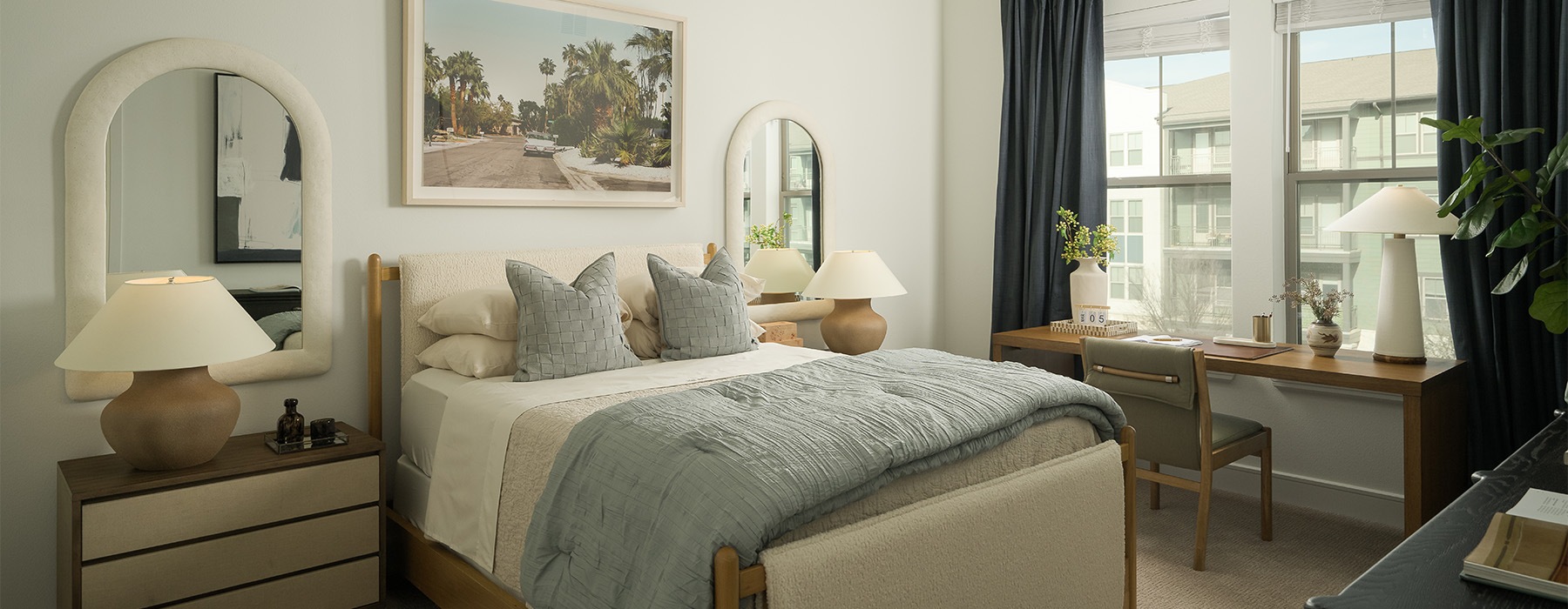 a bedroom with art on the walls